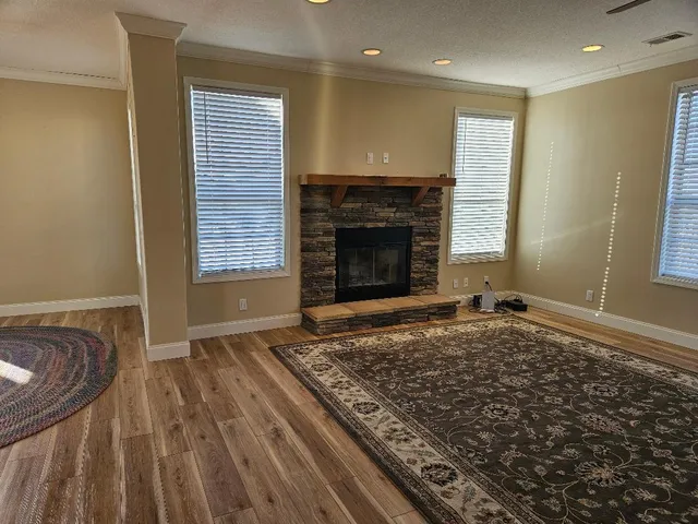 a living room with a rug