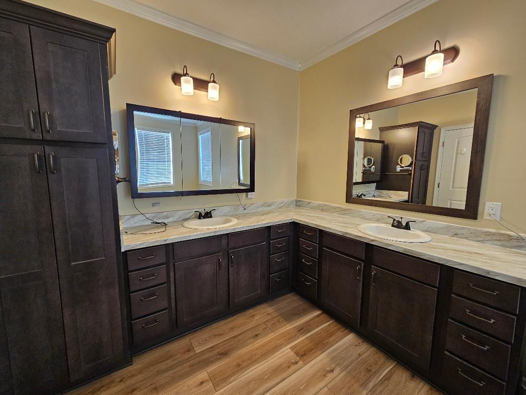 555 Paint Creek Road, Unit C McDade, TX 78650 - Photo 9 of 26 a spacious bathroom with a double vanity sink and a large mirror