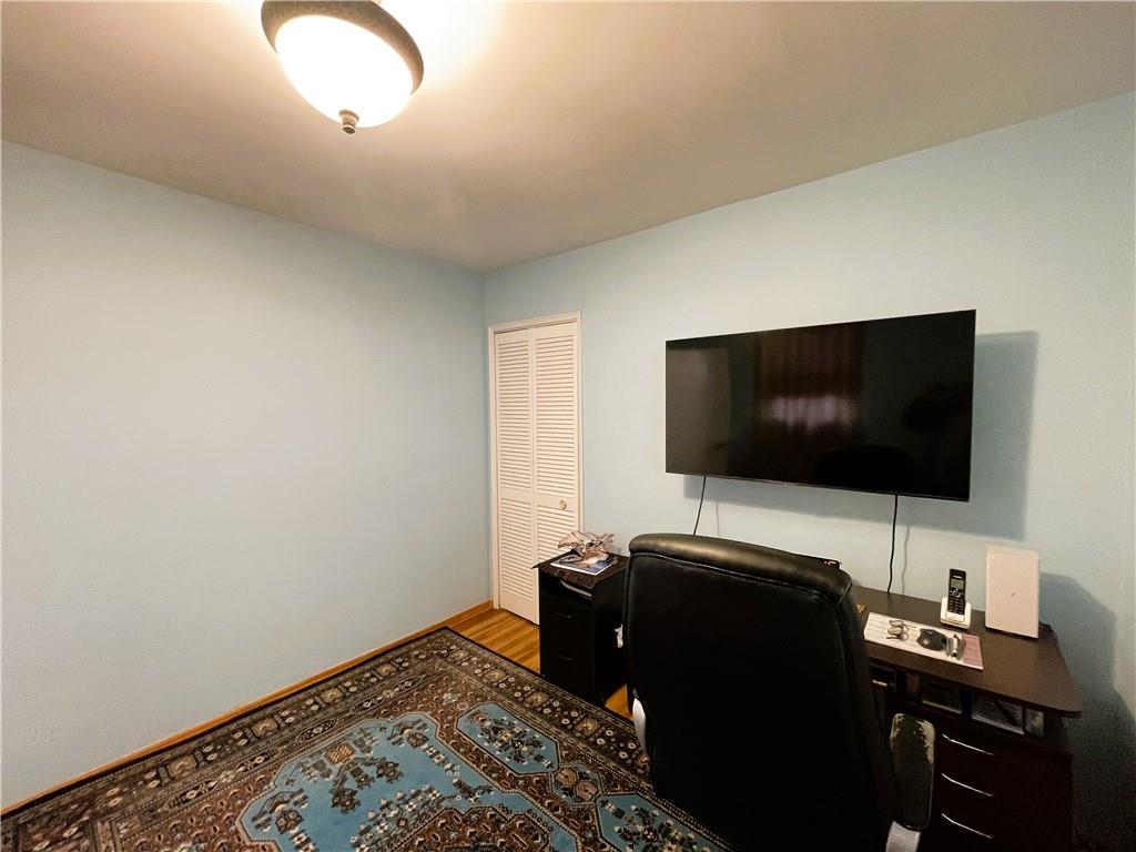 2711 Avenue X, Unit 6J Brooklyn, NY 11235 - Photo 15 of 24 a view of a livingroom with a flat screen tv and a window