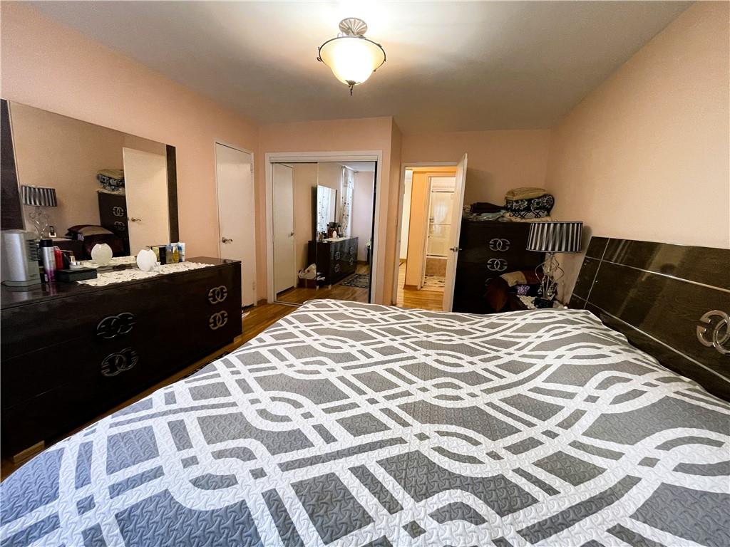 2711 Avenue X, Unit 6J Brooklyn, NY 11235 - Photo 16 of 24 a bedroom with a bed and a dresser