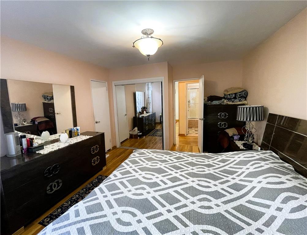 2711 Avenue X, Unit 6J Brooklyn, NY 11235 - Photo 18 of 24 a large bedroom with a bed and a dresser in it