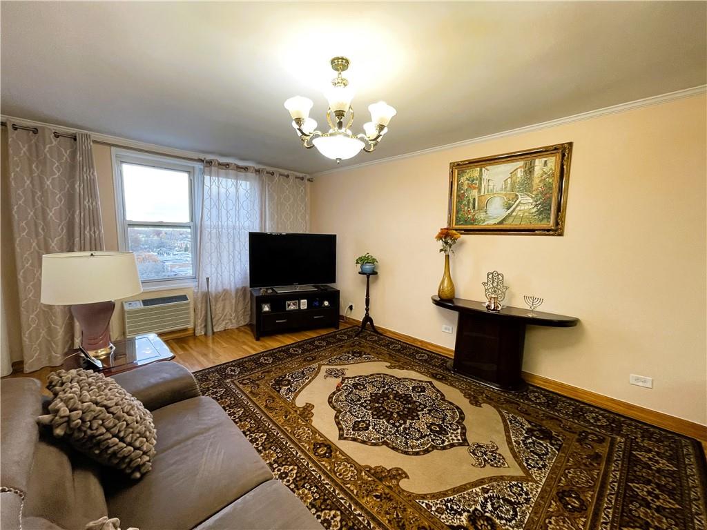 2711 Avenue X, Unit 6J Brooklyn, NY 11235 - Photo 2 of 24 a living room with furniture and a flat screen tv