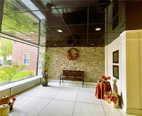 a building outdoor space with glass windows and couch