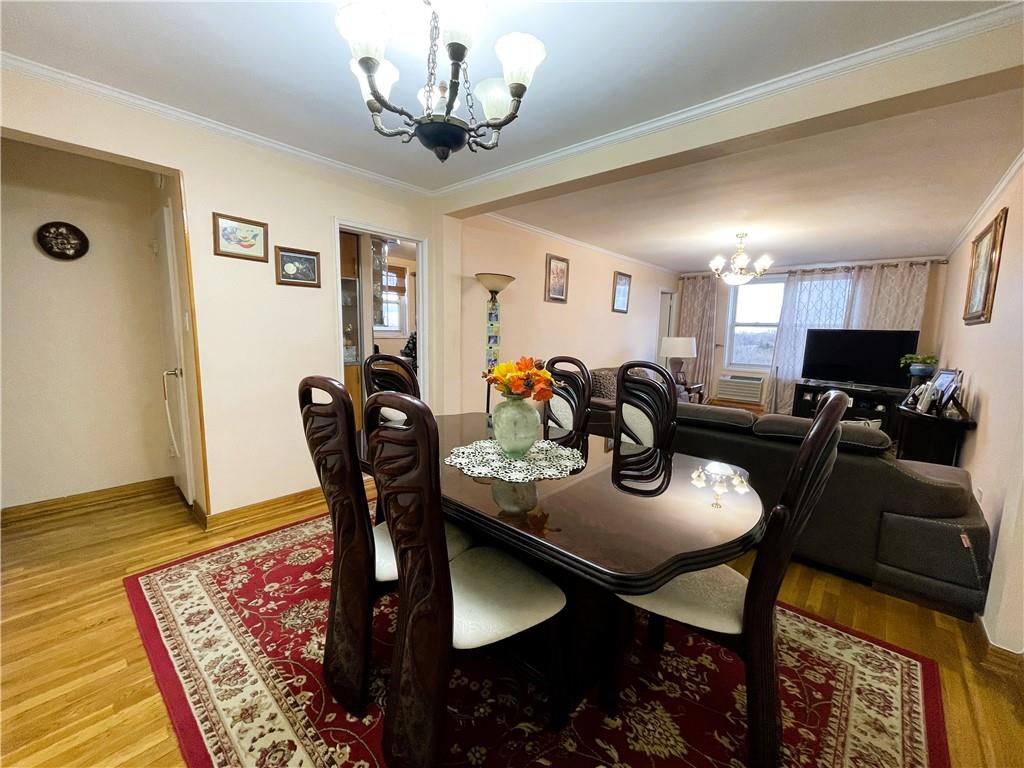 2711 Avenue X, Unit 6J Brooklyn, NY 11235 - Photo 4 of 24 a view of a dining room with furniture and wooden floor
