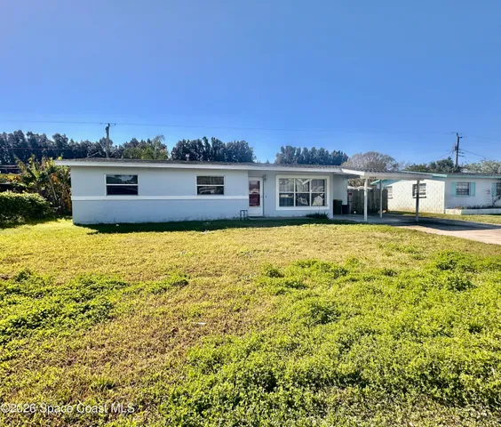 a view of a swimming pool and an outdoor seating