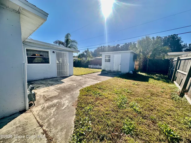 a view of a swimming pool with a chair