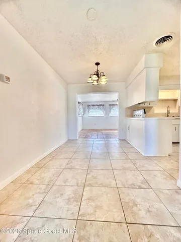 a view of an empty room with a sink