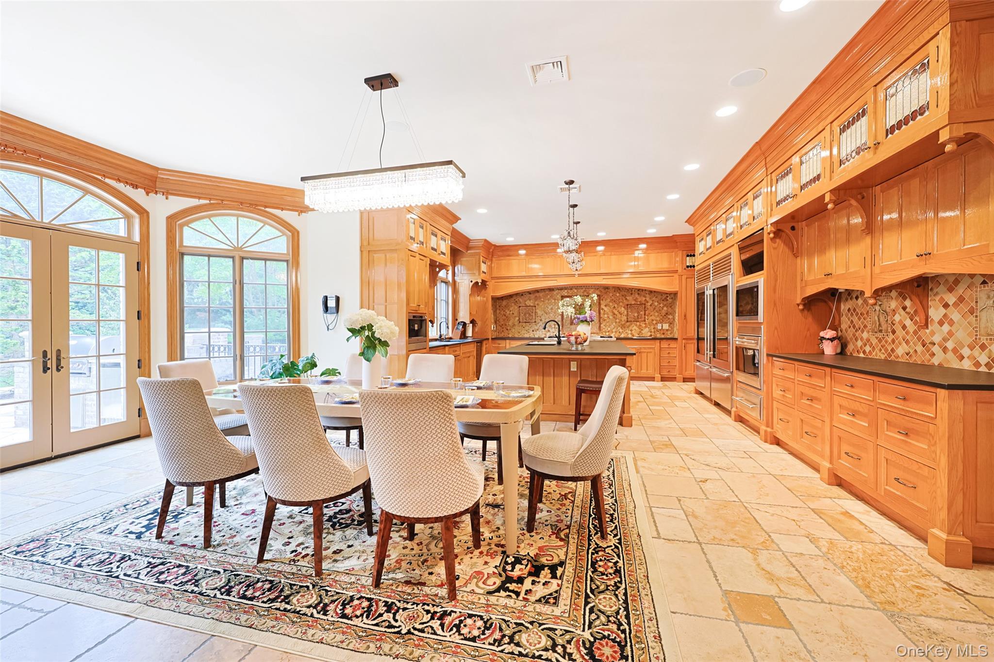 11 Black Rock Road Muttontown, NY 11545 - Photo 17 of 45 a view of a dining room with furniture a chandelier and wooden floor