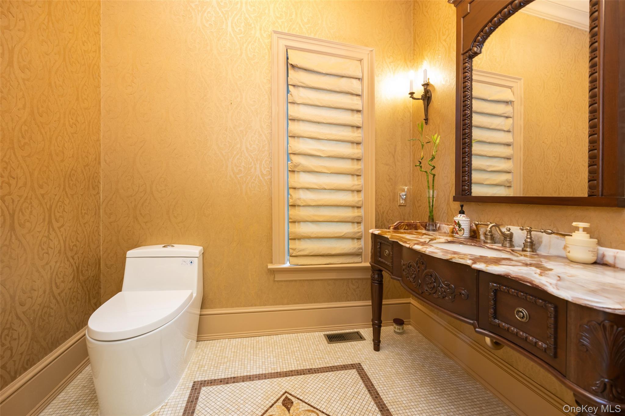 11 Black Rock Road Muttontown, NY 11545 - Photo 19 of 45 a bathroom with a granite countertop sink and a toilet