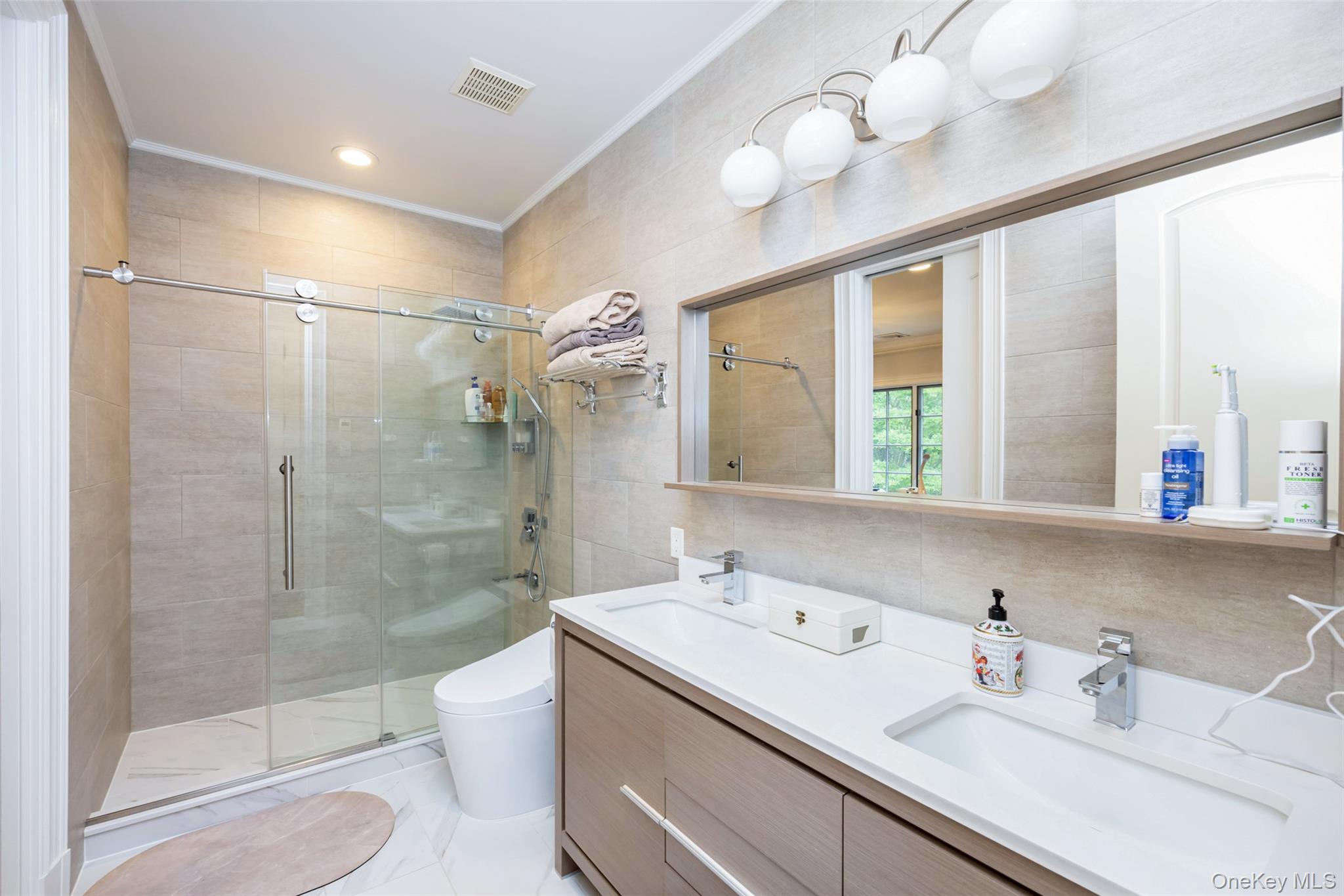 11 Black Rock Road Muttontown, NY 11545 - Photo 28 of 45 a bathroom with a sink shower and a mirror