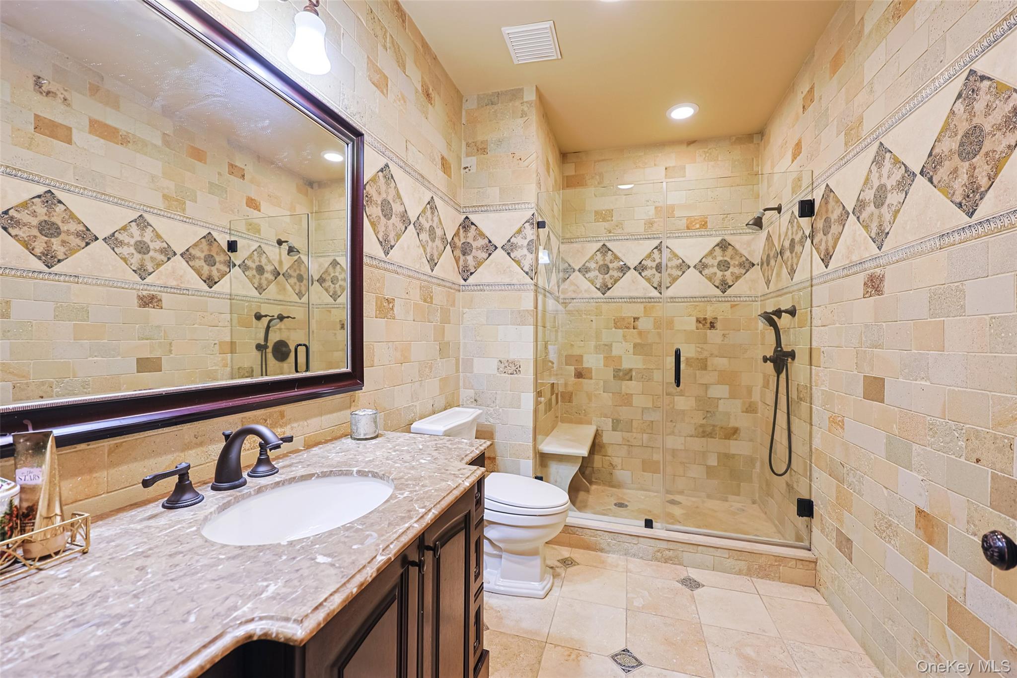 11 Black Rock Road Muttontown, NY 11545 - Photo 40 of 45 a bathroom with a granite countertop sink a toilet a mirror and shower