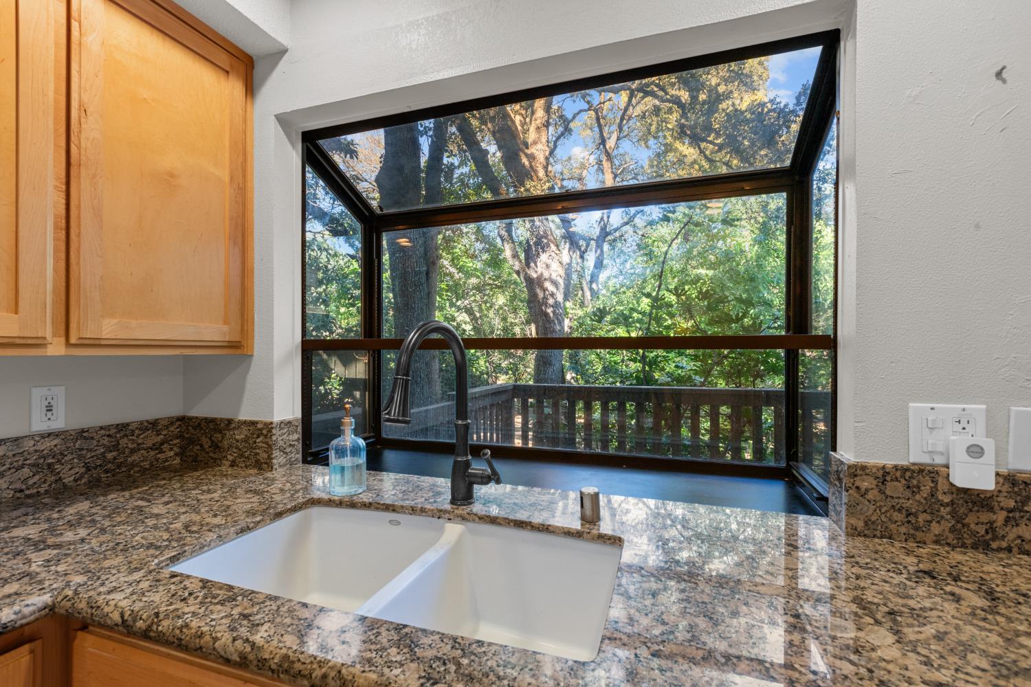 6909 Monticello Court Citrus Heights, CA 95621 - Photo 15 of 38 a kitchen with a large window in it and living room