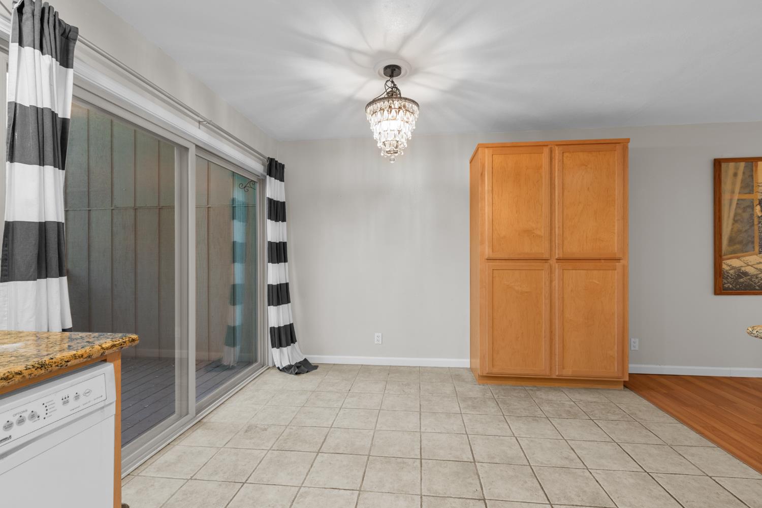 6909 Monticello Court Citrus Heights, CA 95621 - Photo 16 of 38 a view of an empty room with window and chandelier fan