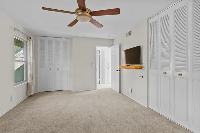 a view of room with walk in closet and window