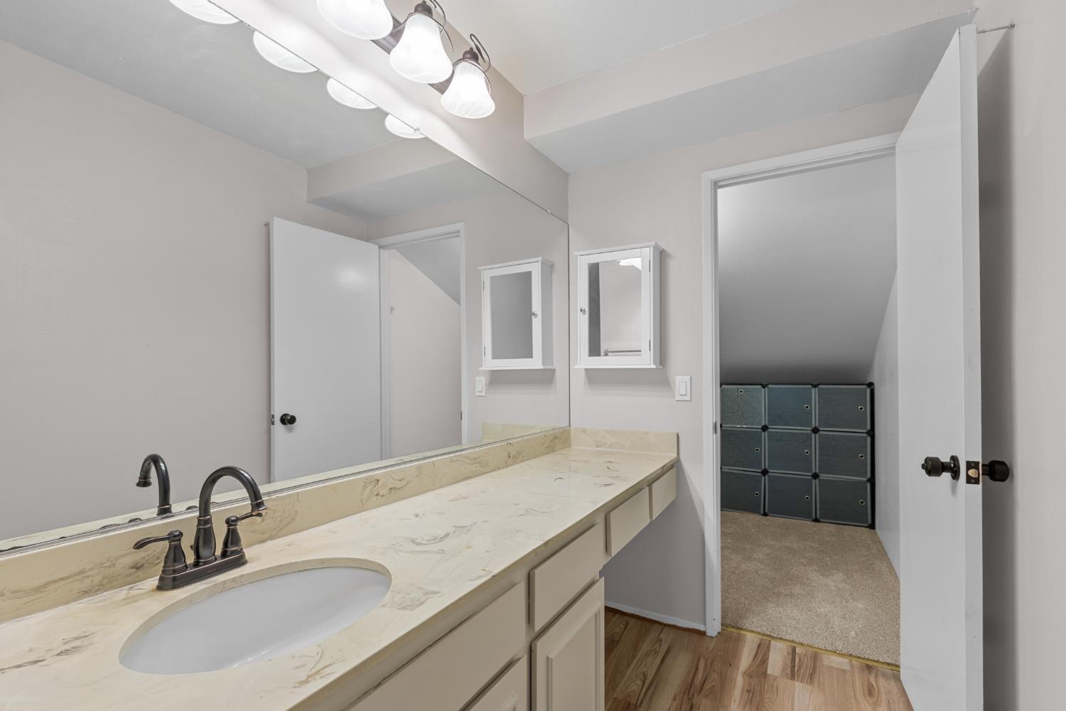 6909 Monticello Court Citrus Heights, CA 95621 - Photo 27 of 38 a bathroom with a sink a vanity and a mirror