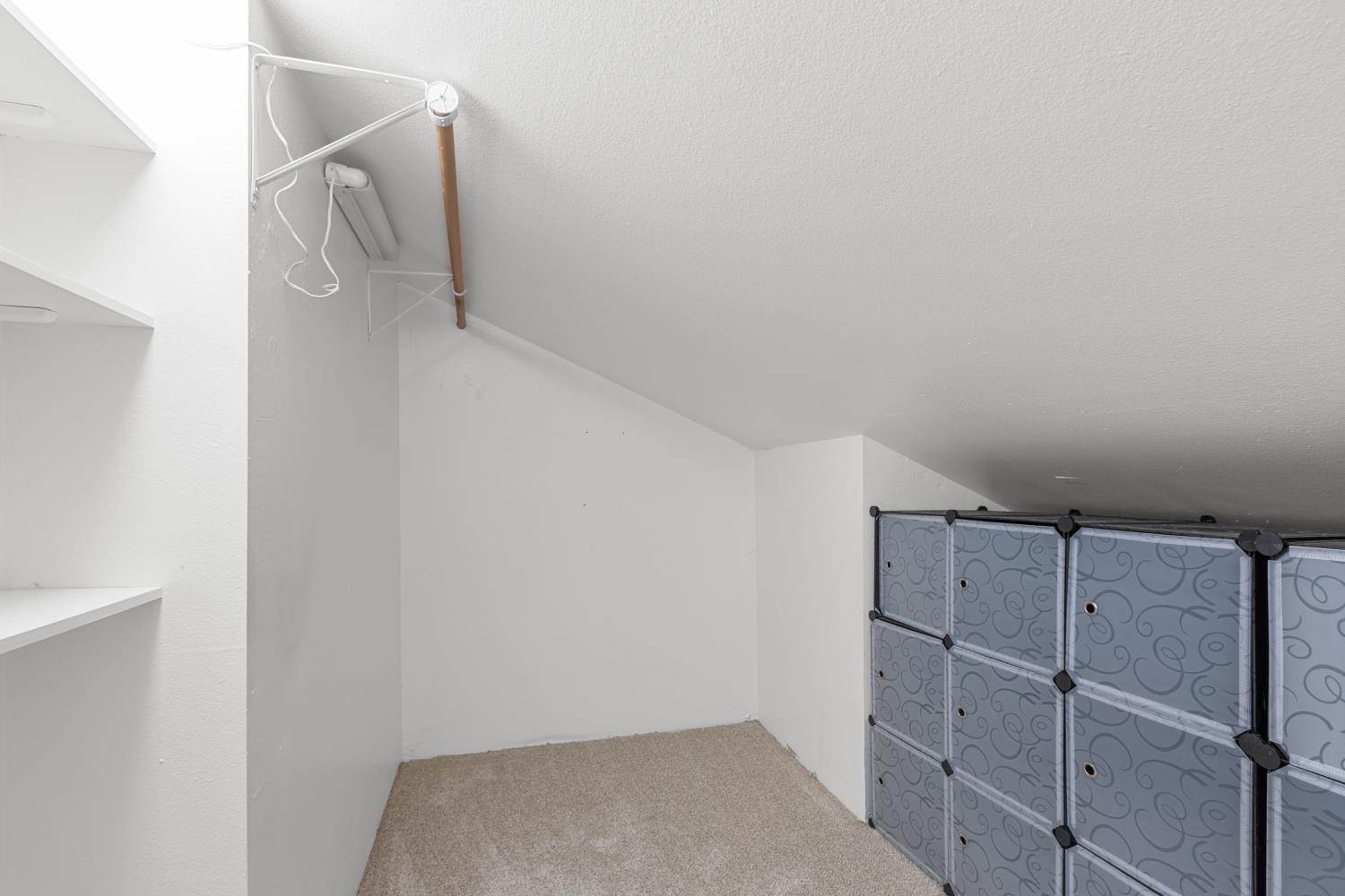 6909 Monticello Court Citrus Heights, CA 95621 - Photo 28 of 38 a view of walk in closet with racks on the wall
