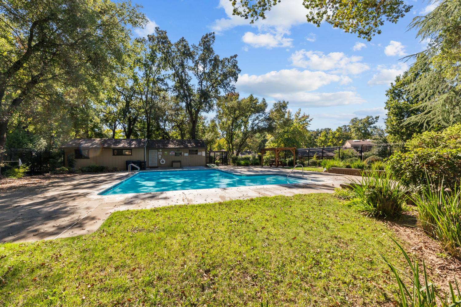 6909 Monticello Court Citrus Heights, CA 95621 - Photo 36 of 38 a view of a swimming pool with an outdoor space and seating area