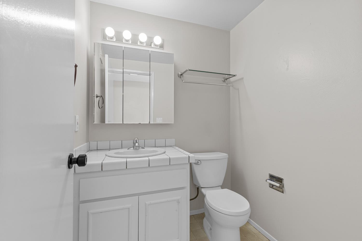 6909 Monticello Court Citrus Heights, CA 95621 - Photo 6 of 38 a bathroom with a sink toilet and a mirror
