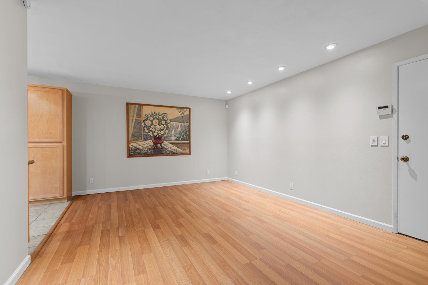 6909 Monticello Court Citrus Heights, CA 95621 - Photo 10 of 38 a view of an empty room with wooden floor and a window