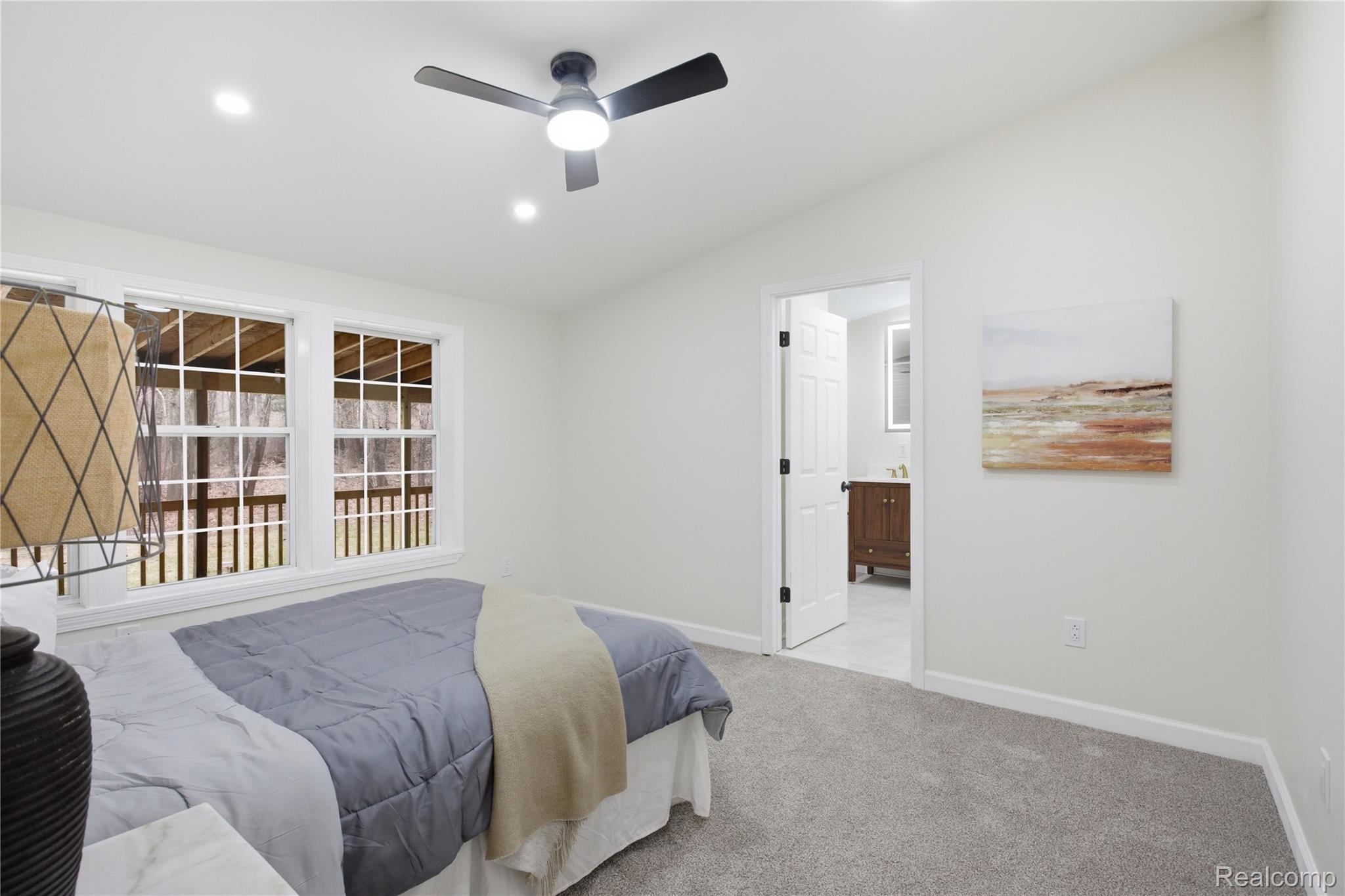 5350 List Road Grass Lake, MI 49240 - Photo 24 of 71 Bedroom with vaulted ceiling, light colored carpet, ceiling fan, ensuite bath, and recessed lighting