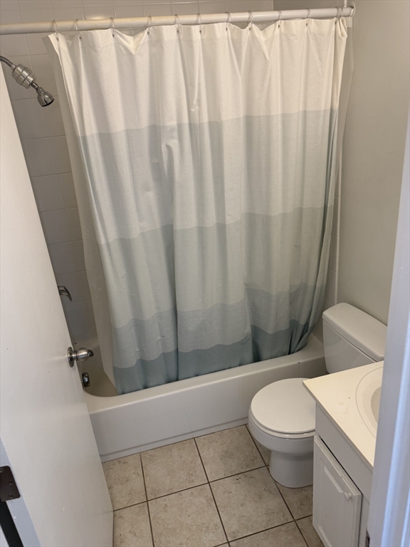 160 Cottage Street, Unit 2 Boston, MA 02128 - Photo 9 of 11 a white toilet sitting next to a sink