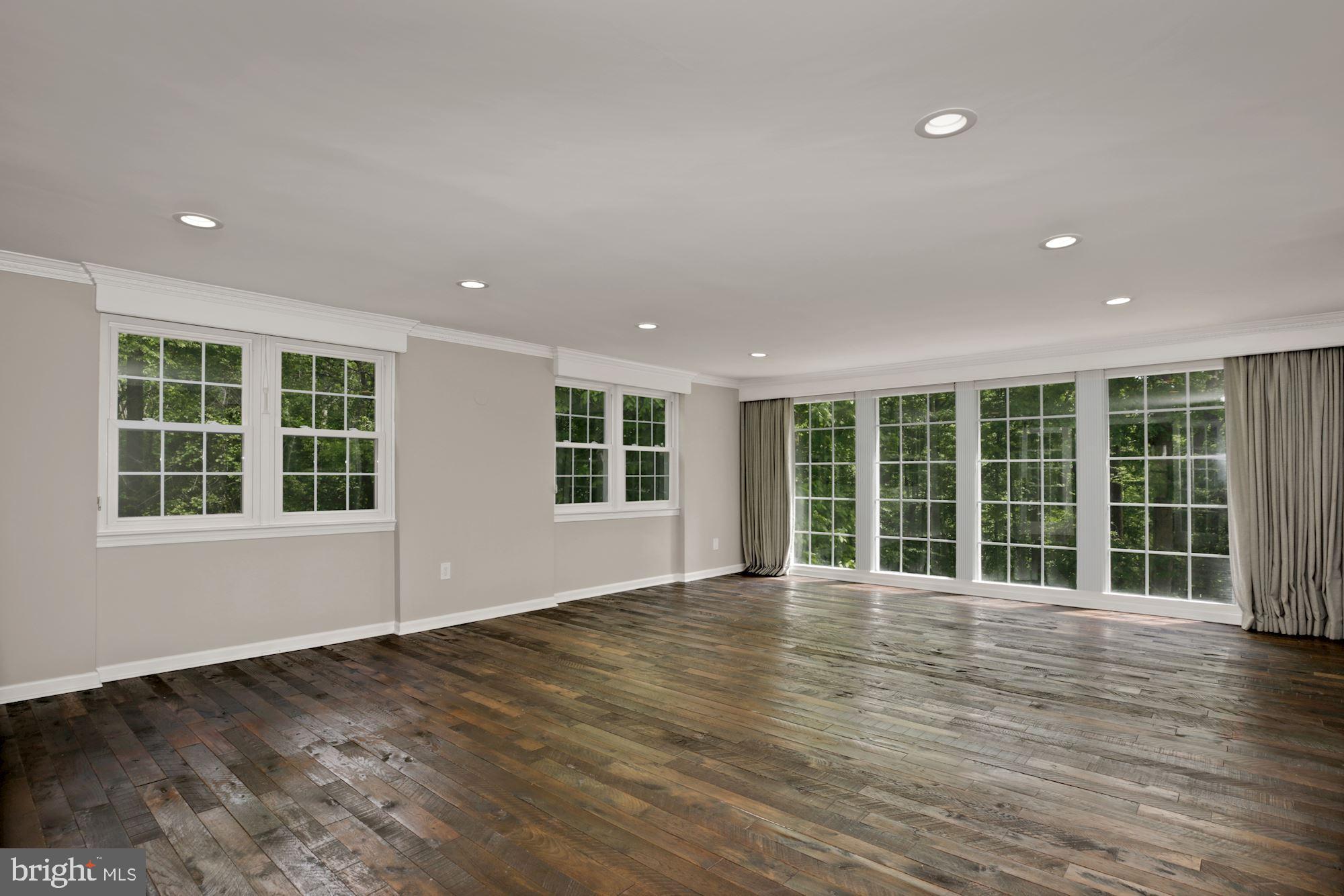 8111 West Point Drive Springfield, VA 22153 - Photo 12 of 46 a view of an empty room with a window and wooden floor