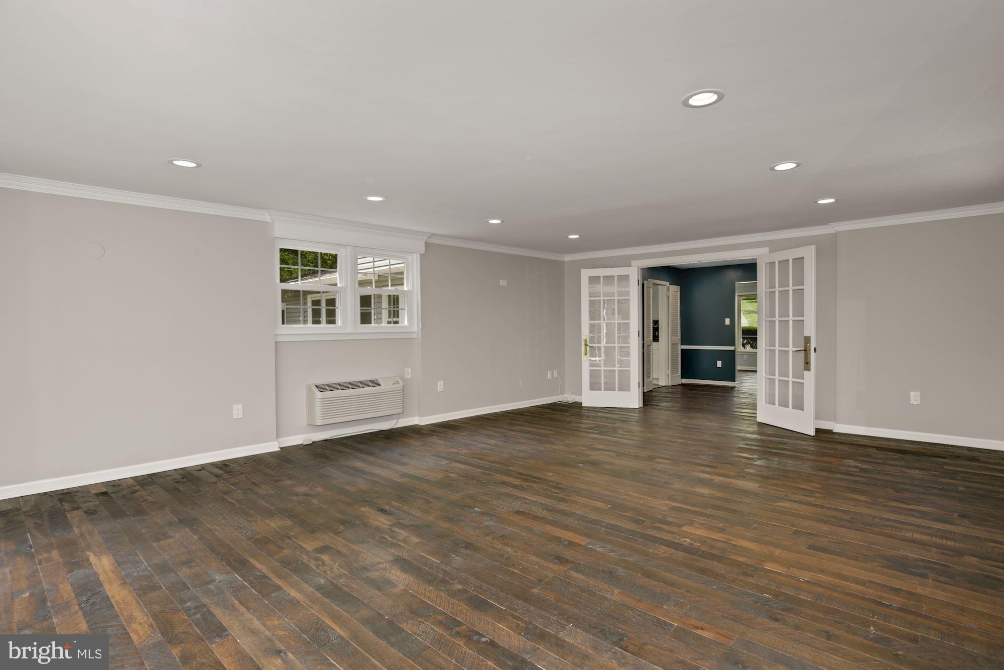 8111 West Point Drive Springfield, VA 22153 - Photo 15 of 46 a view of an empty room with wooden floor and a window