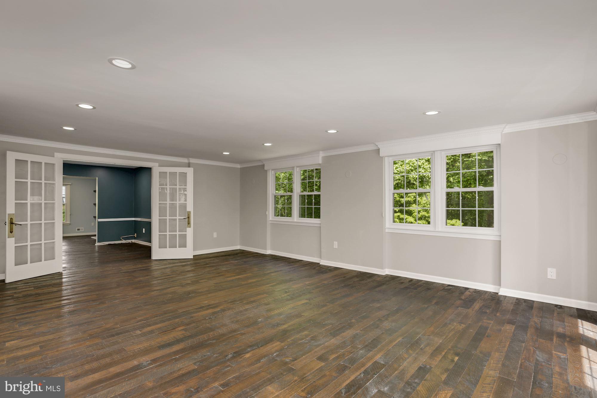 8111 West Point Drive Springfield, VA 22153 - Photo 16 of 46 an empty room with wooden floor and windows