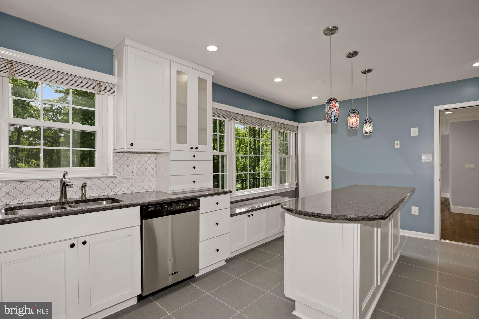 8111 West Point Drive Springfield, VA 22153 - Photo 19 of 46 a kitchen with granite countertop a sink and cabinets