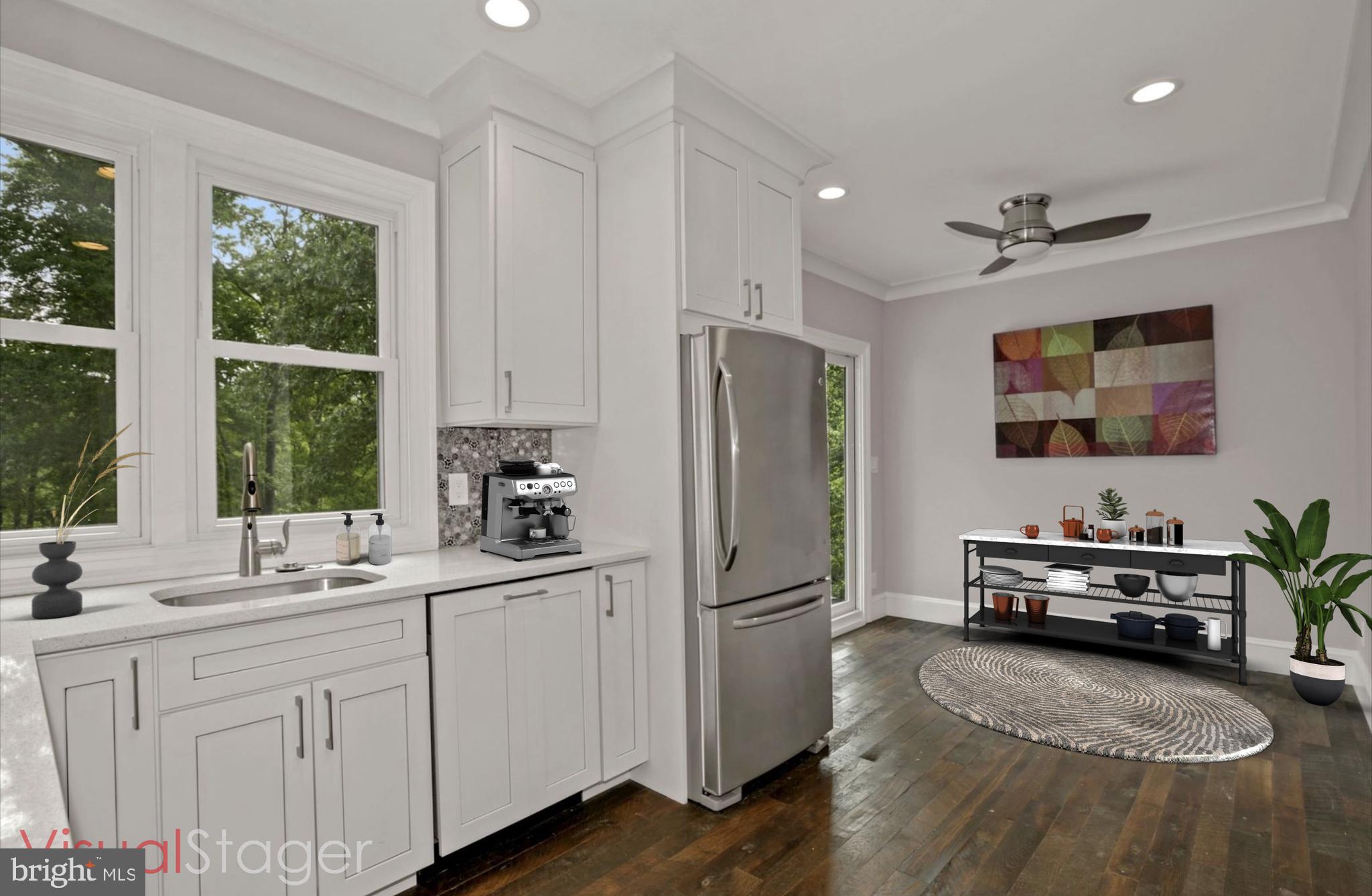 8111 West Point Drive Springfield, VA 22153 - Photo 24 of 46 a kitchen with sink refrigerator and window