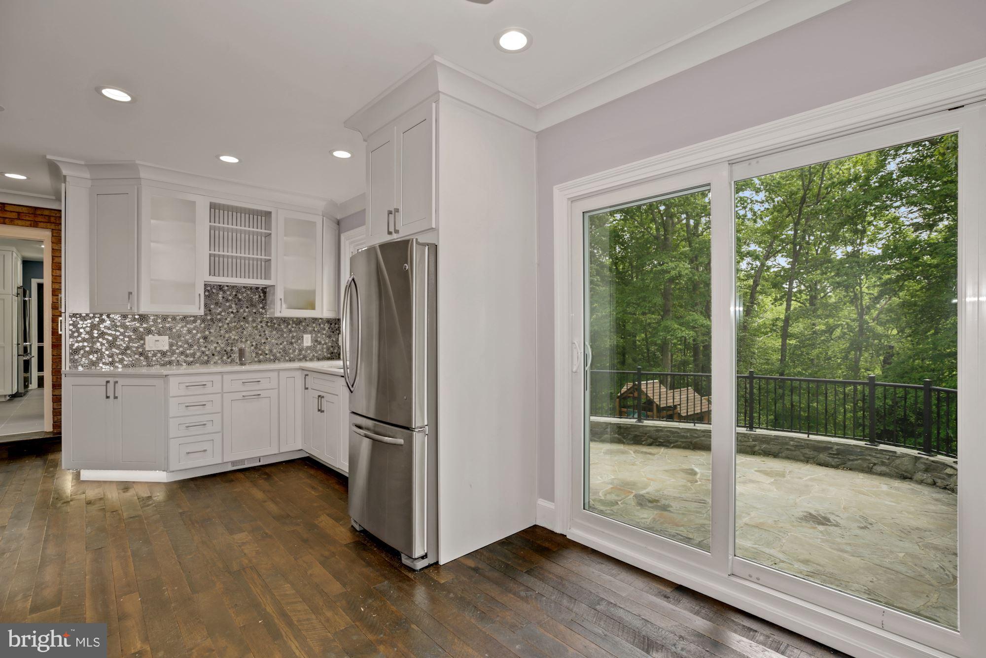 8111 West Point Drive Springfield, VA 22153 - Photo 25 of 46 a kitchen with stainless steel appliances granite countertop a refrigerator and a sink
