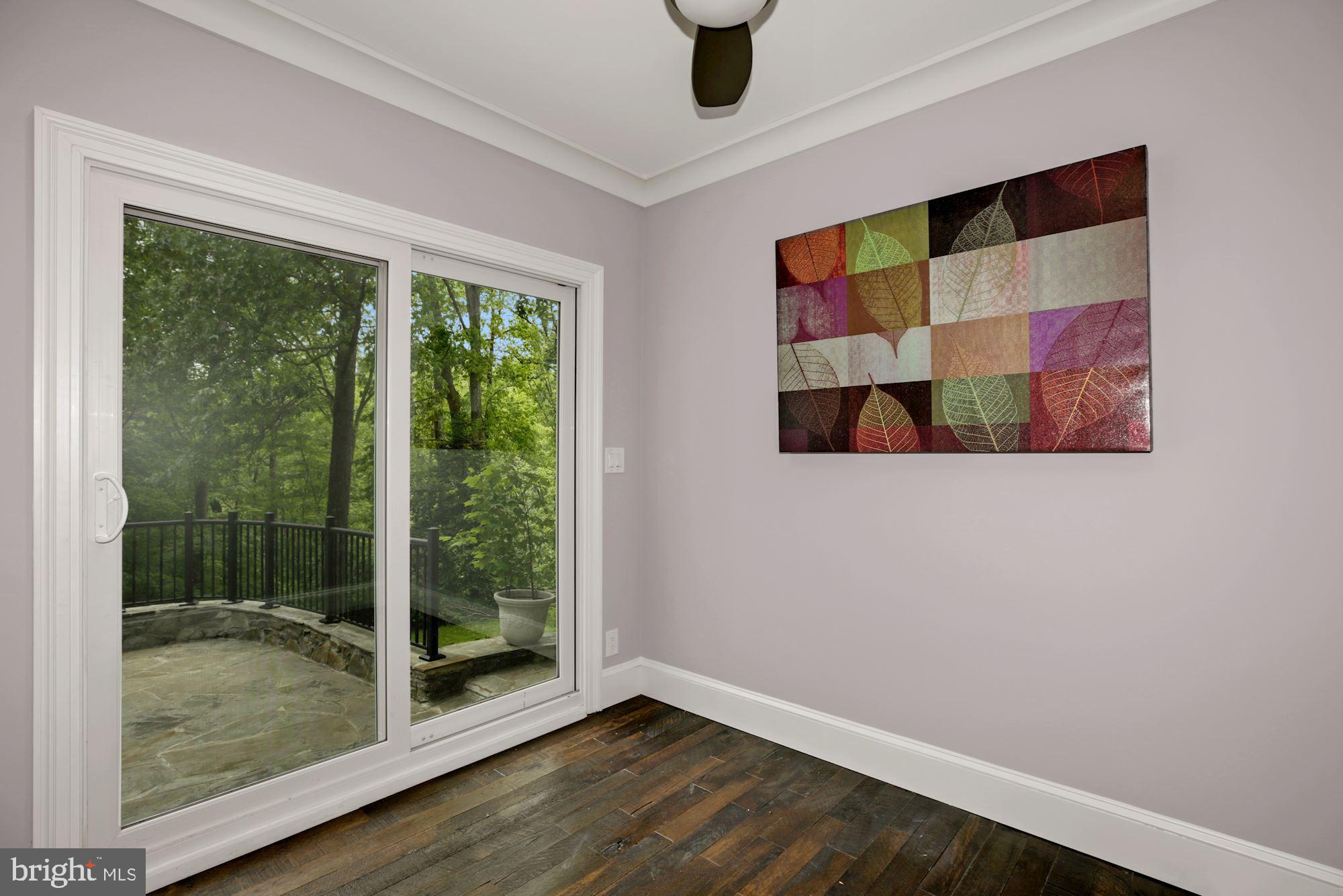 8111 West Point Drive Springfield, VA 22153 - Photo 26 of 46 a view of empty room with wooden floor and fan