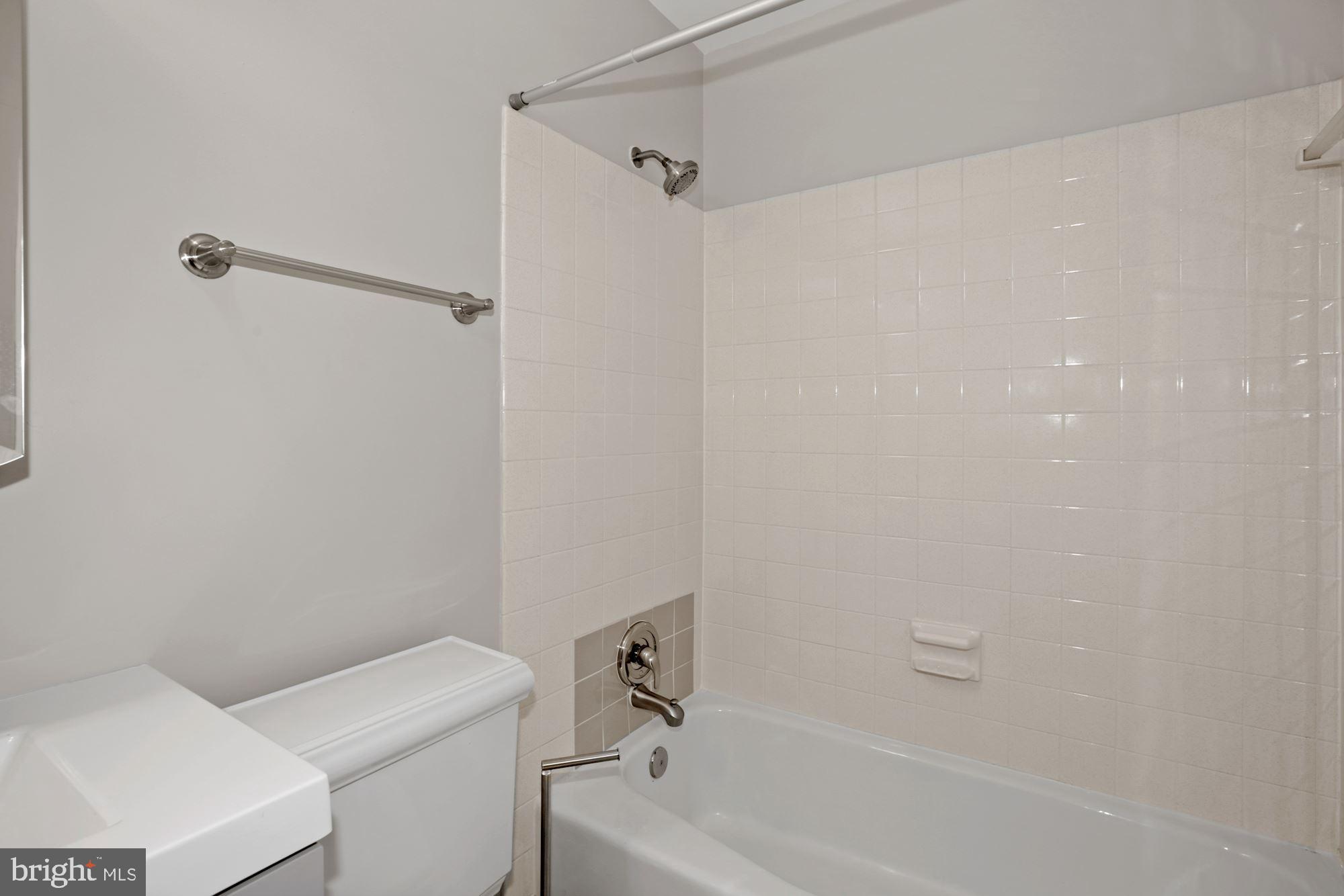 8111 West Point Drive Springfield, VA 22153 - Photo 28 of 46 a bathroom with a shower and a toilet