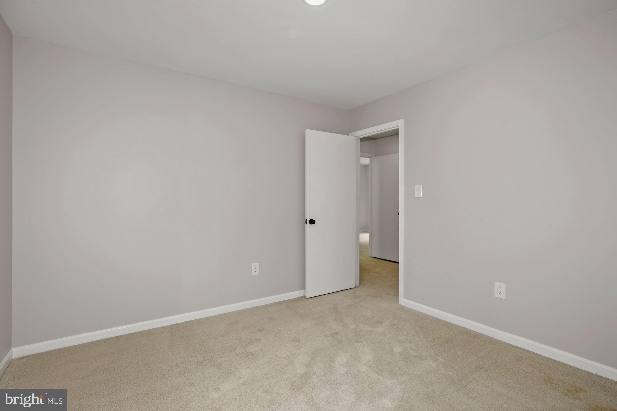 8111 West Point Drive Springfield, VA 22153 - Photo 30 of 46 a view of an empty room and a walk in closet
