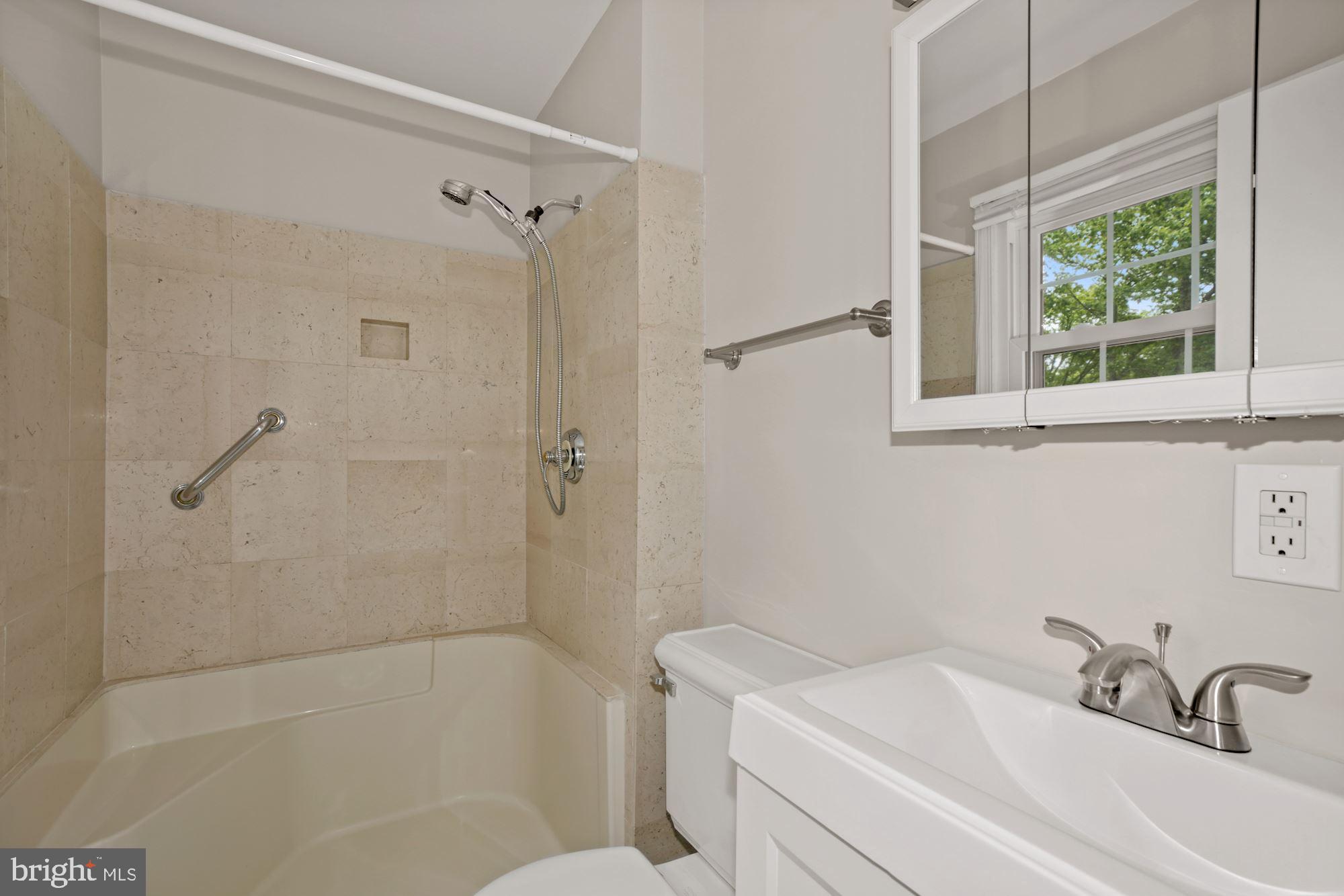 8111 West Point Drive Springfield, VA 22153 - Photo 34 of 46 a bathroom with a sink a toilet and shower