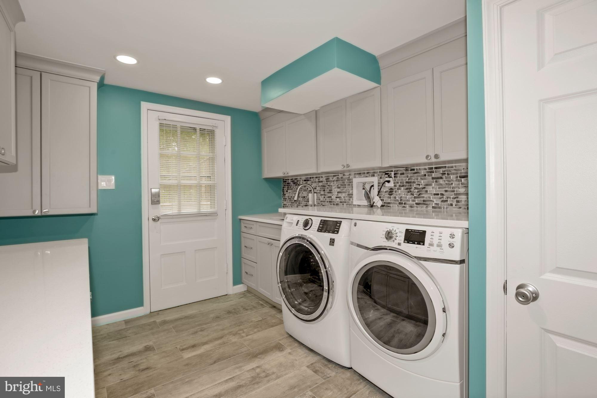 8111 West Point Drive Springfield, VA 22153 - Photo 41 of 46 a view of hallway with washer and dryer