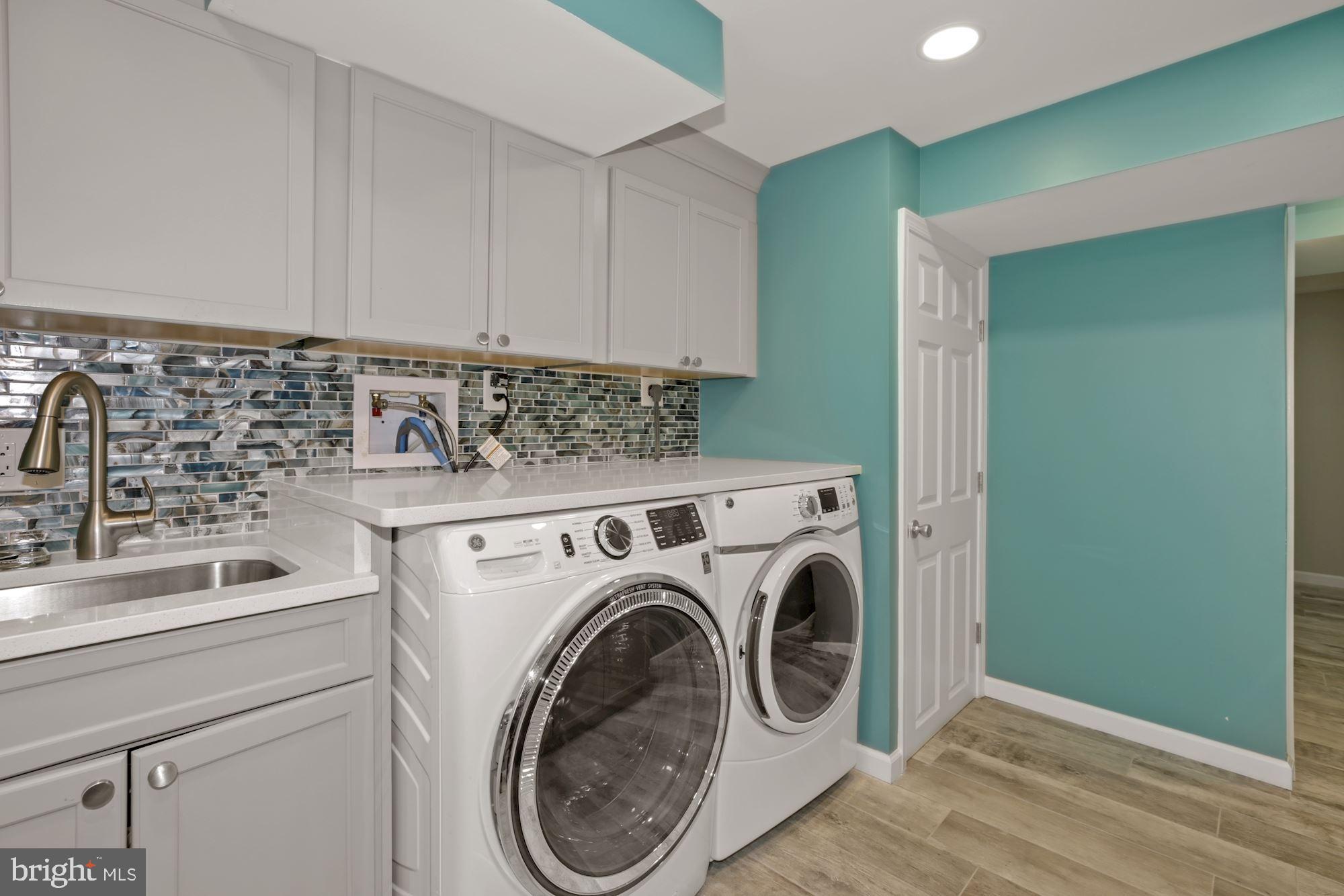 8111 West Point Drive Springfield, VA 22153 - Photo 42 of 46 a utility room with dryer and washer