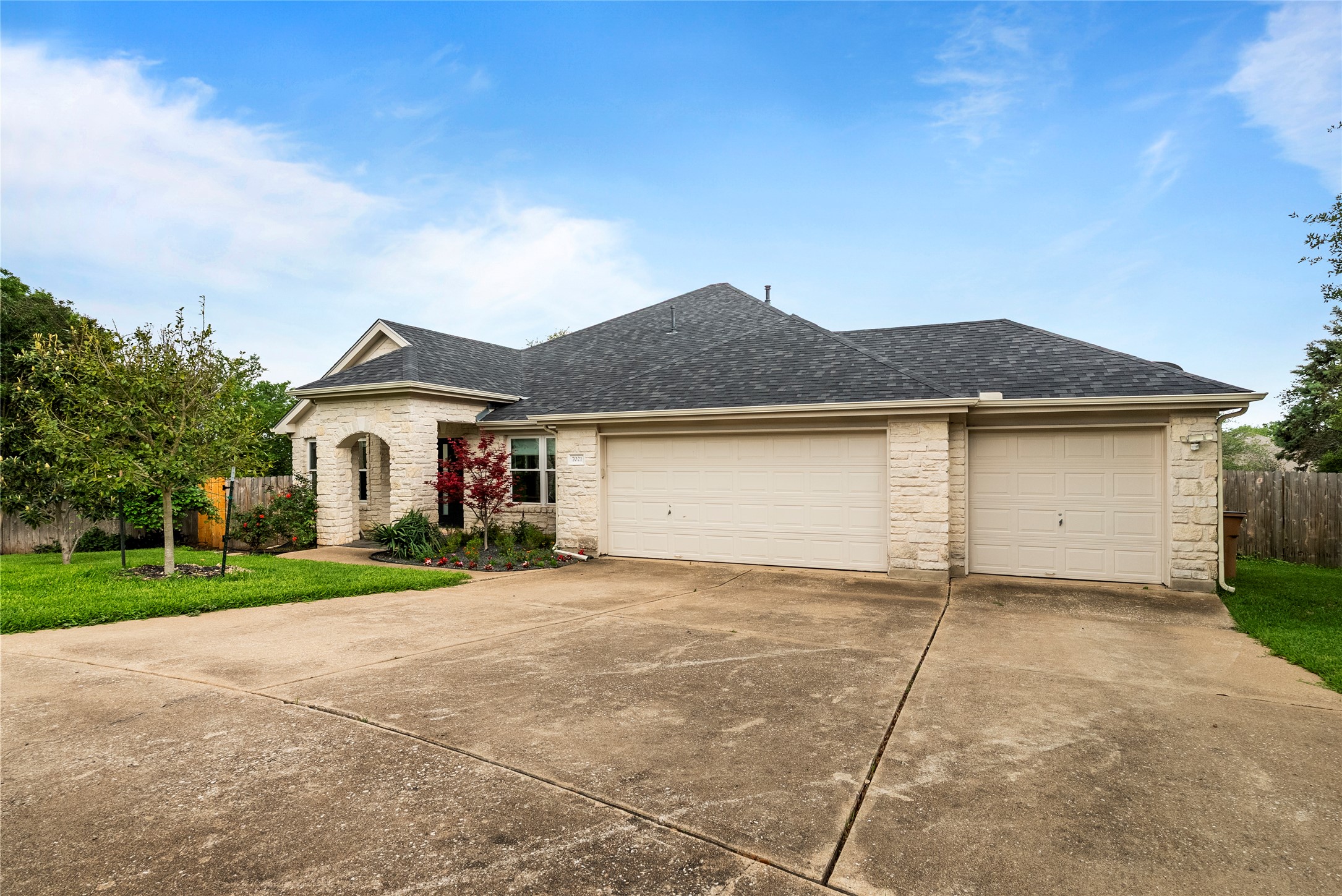 7021 Colberg Court Austin, TX 78749 - Photo 11 of 37 a front view of a house with a yard and garage