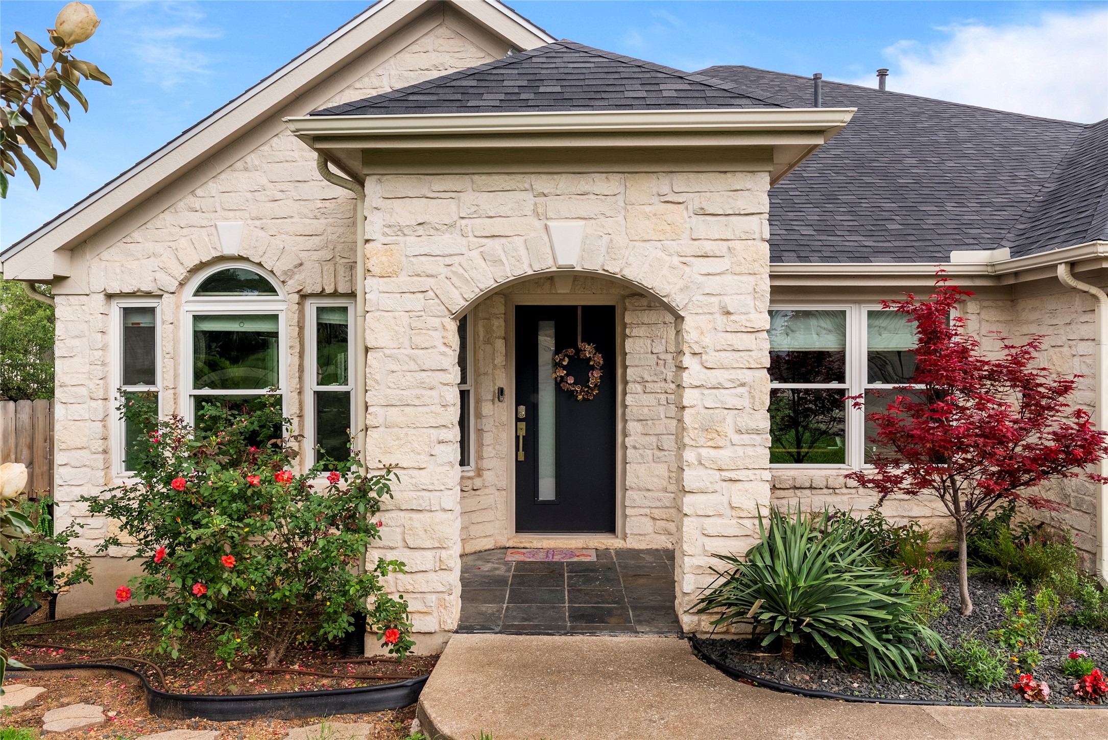 7021 Colberg Court Austin, TX 78749 - Photo 12 of 37 a front view of a house with plants