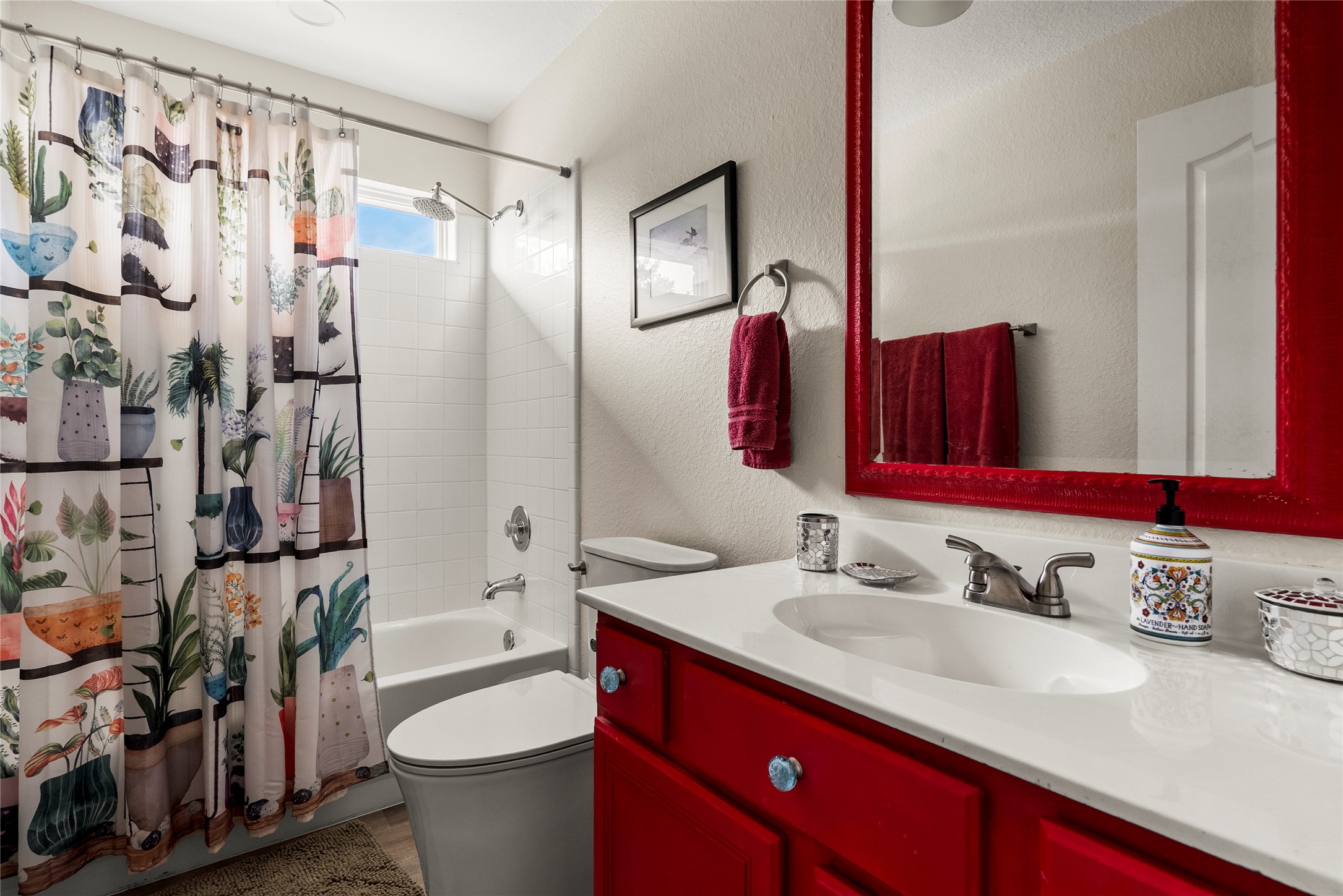 7021 Colberg Court Austin, TX 78749 - Photo 30 of 37 a bathroom with a sink vanity mirror and toilet