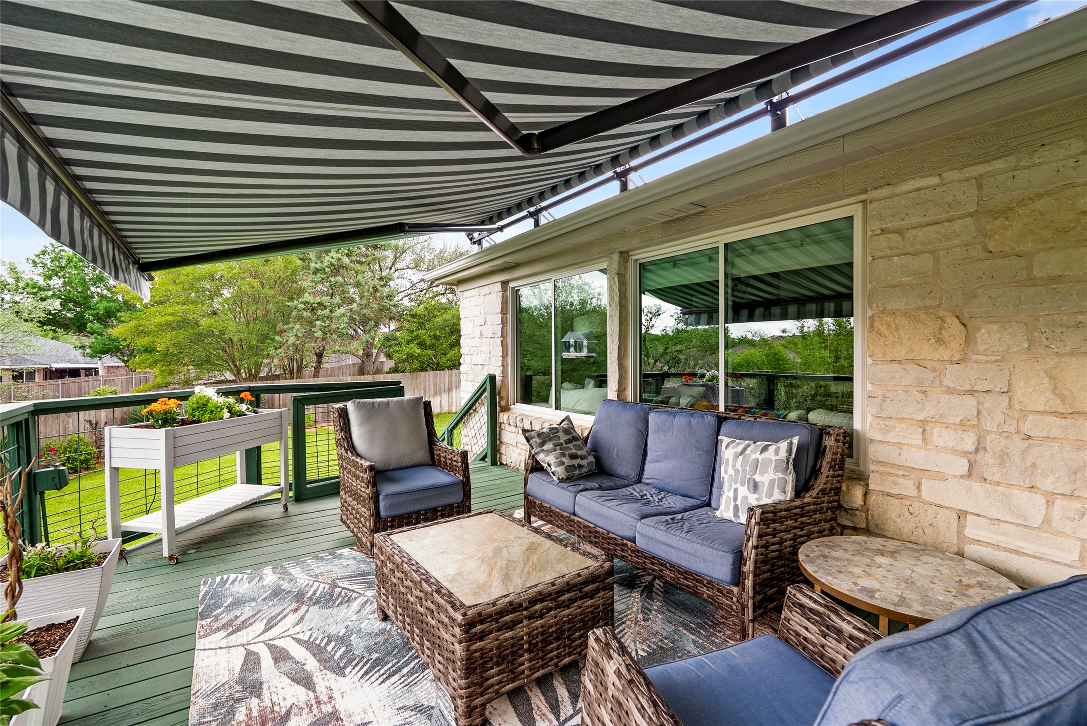 7021 Colberg Court Austin, TX 78749 - Photo 32 of 37 a living room with patio furniture and a grill