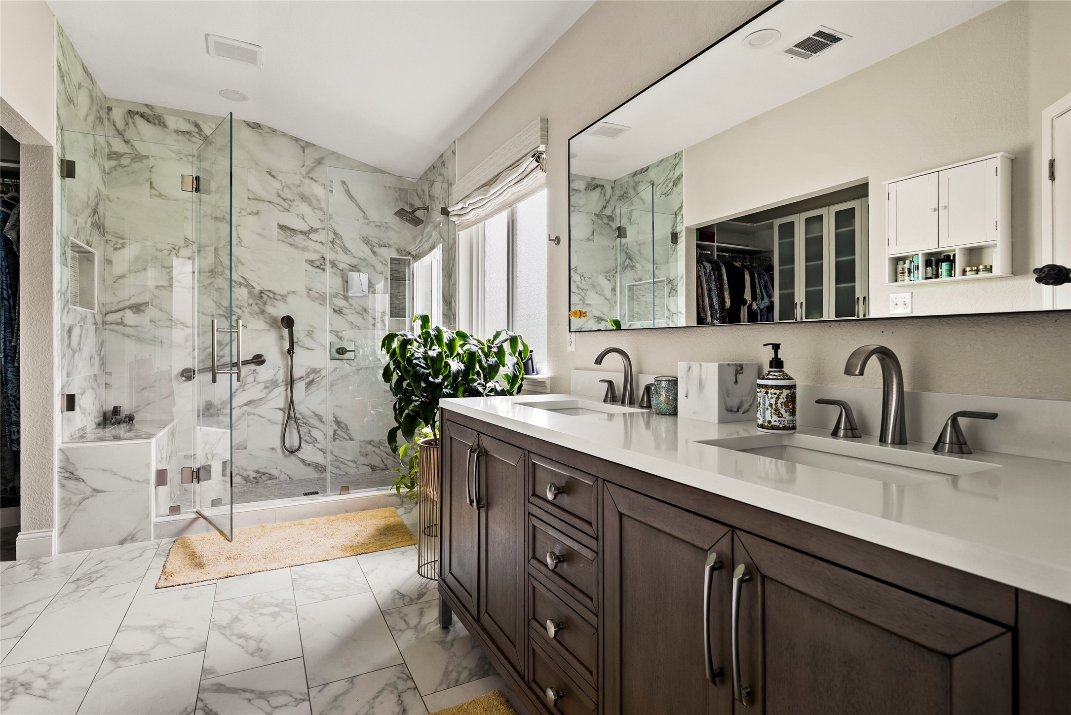 7021 Colberg Court Austin, TX 78749 - Photo 8 of 37 a spacious bathroom with a granite countertop sink mirror and a bath tub