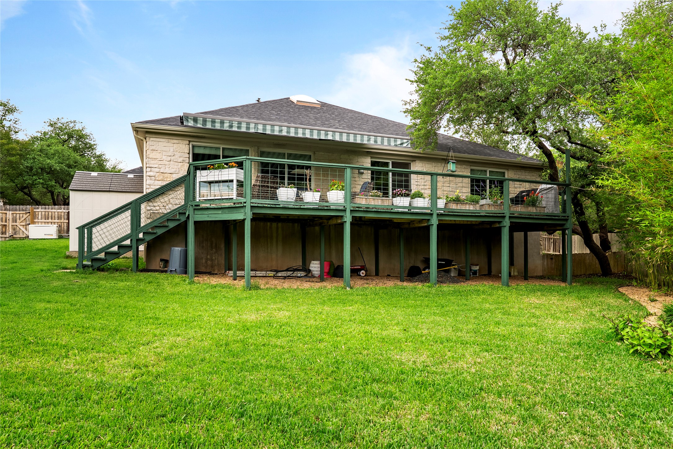 7021 Colberg Court Austin, TX 78749 - Photo 9 of 37 a view of a house with a yard and sitting area