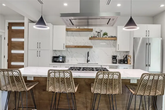 a kitchen with cabinets a sink and a stove