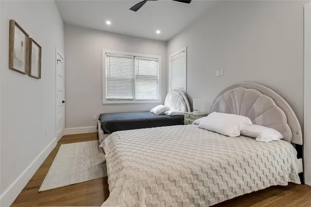 a bedroom with bed and window