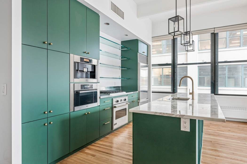 1 Main Street, Unit 2J Brooklyn, NY 11201 - Photo 10 of 23 a kitchen with a sink cabinets and stainless steel appliances