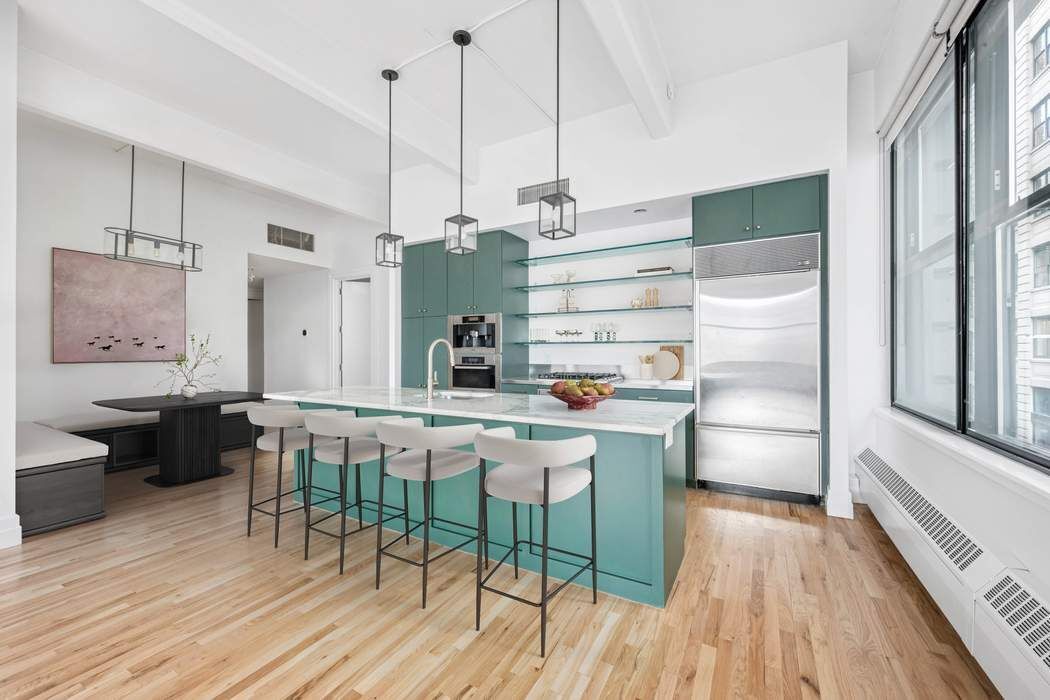 1 Main Street, Unit 2J Brooklyn, NY 11201 - Photo 8 of 23 a kitchen with stainless steel appliances a dining table chairs and wooden floor
