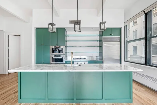 a kitchen with a sink and a large window