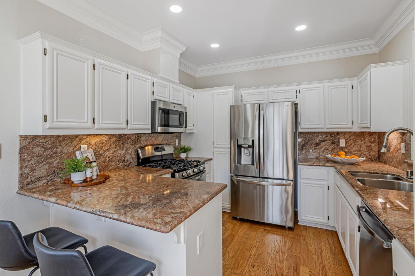 298 Gemstone Way Milpitas, CA 95035 - Photo 12 of 41 a kitchen with stainless steel appliances granite countertop a refrigerator stove and sink
