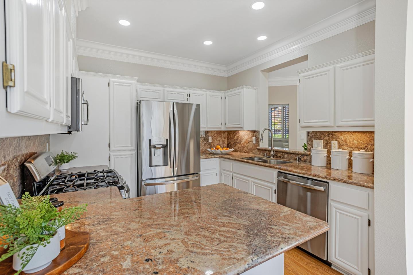 298 Gemstone Way Milpitas, CA 95035 - Photo 13 of 41 a kitchen with stainless steel appliances granite countertop a refrigerator sink stove microwave and cabinets